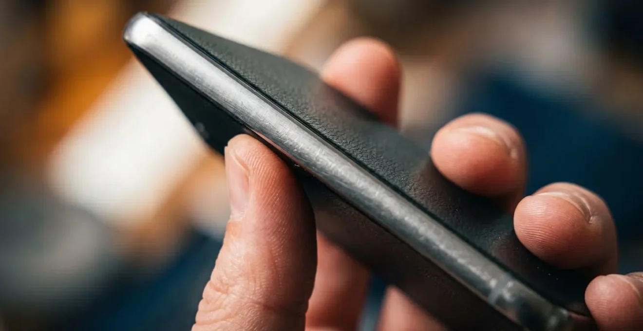 Close-up of smartphone displaying simulated phishing warning and immediate educational feedback interface