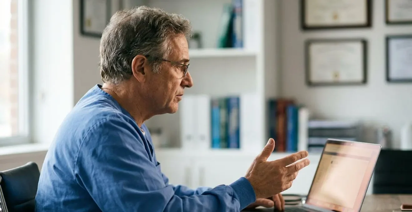 A healthcare professional conducting a virtual medical consultation via video call, emphasizing the technological divide between remote and in-person care